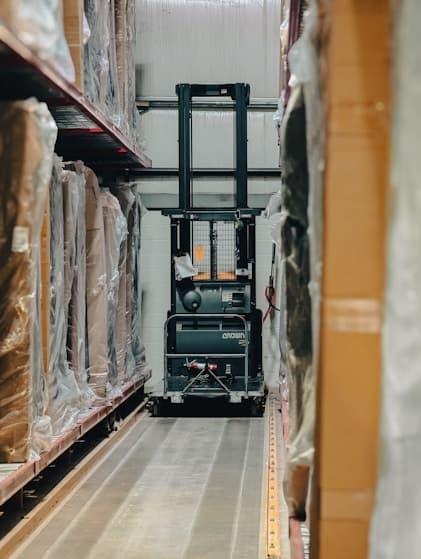 Forklift in industrial warehouse
